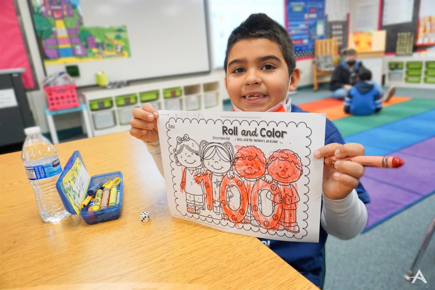 Student displaying art work
